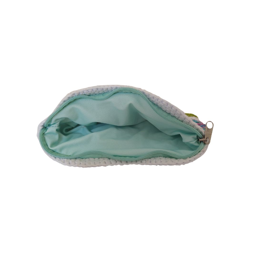 Inside of the crochet pouch showing the seafoam fabric lining