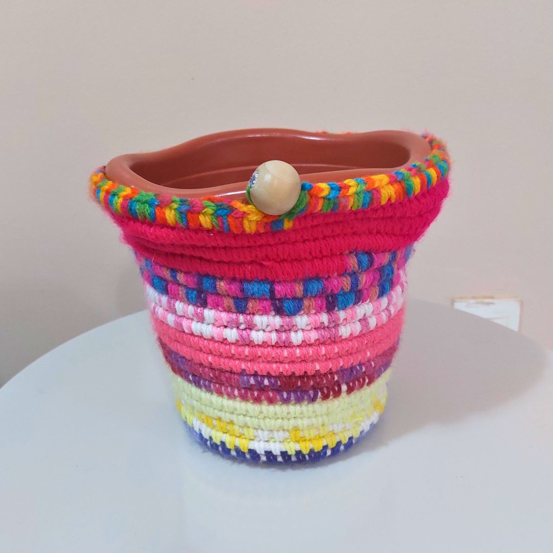 Handmade colorful crochet storage basket with wooden button